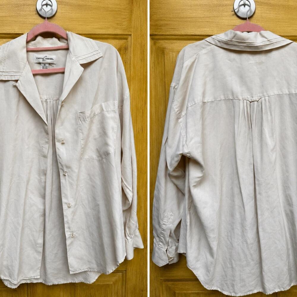 Cream 100 percent silk button-up shirt with a relaxed fit, size M